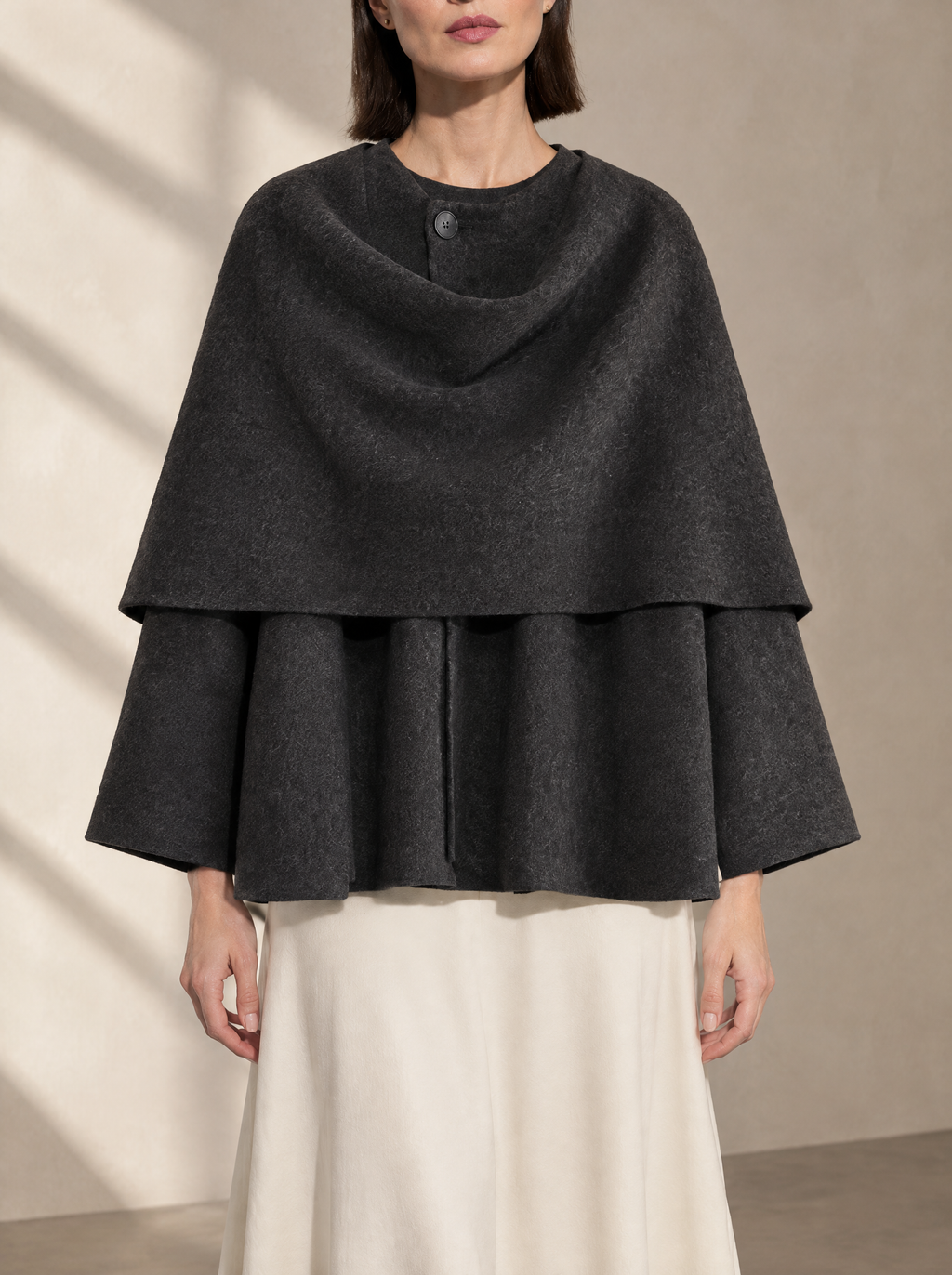 Warm editorial room · Soft sophisticated / old money Grey bust to thigh