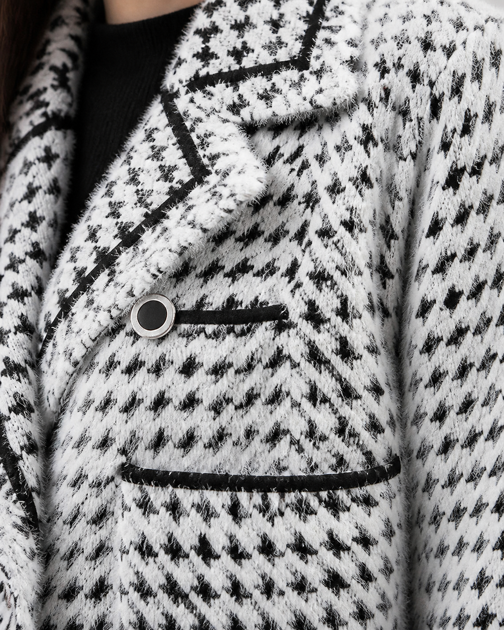White cardigan — texture and button detail